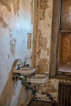 Ellis Island Hospital Tuberculosis patient's had two sinks in their room if they were coughing up blood they needed to use the small sink which moved the fluids to a different disposal area.